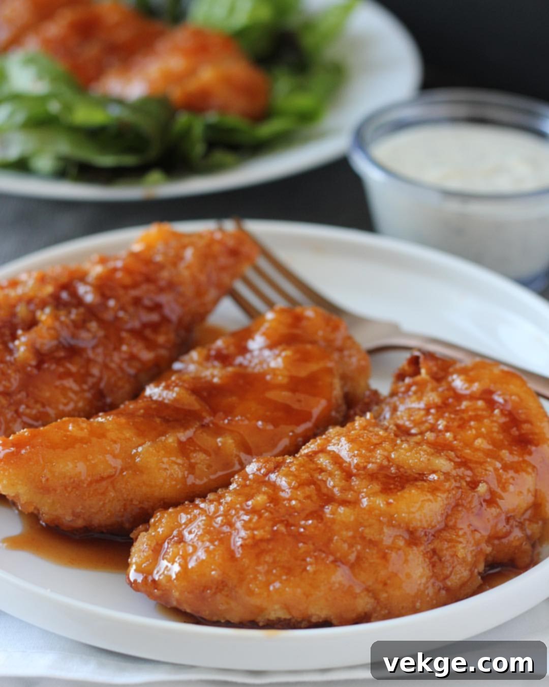 Delicious Winger's style chicken tenders glazed with homemade sweet and spicy sauce.
