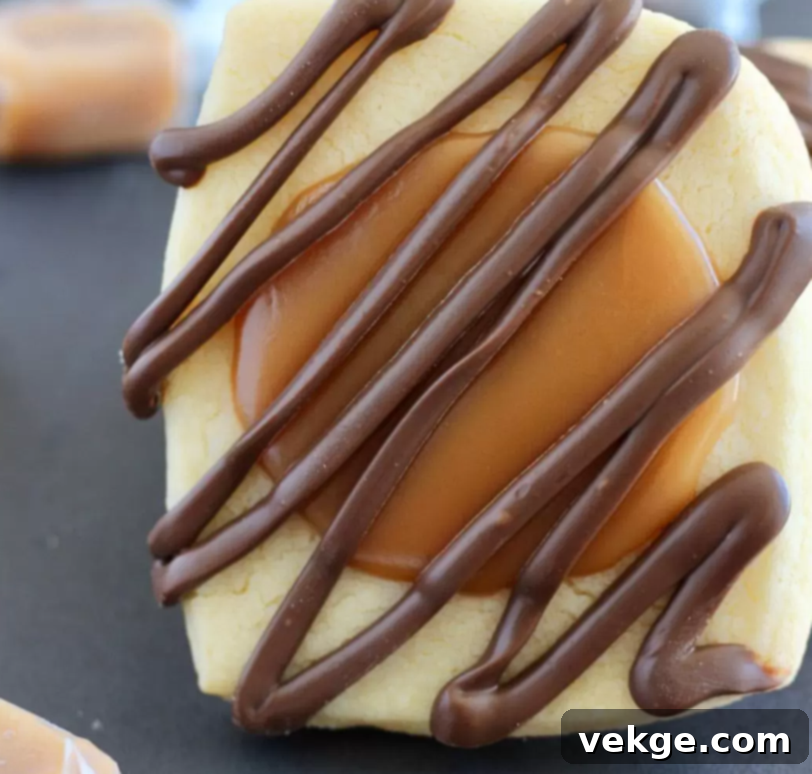 Ultimate Twix Cookie Delight 4 Beautifully arranged Twix Cookies on a platter, showcasing their delicious layers.