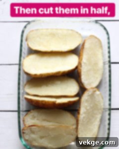 Double-Baked Delight 6 Cutting a baked potato in half lengthwise to prepare for scooping.