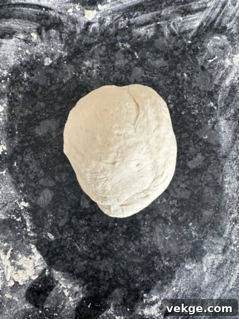 Artisan Rosemary Sourdough French Bread 11 Dough being kneaded to a smooth consistency