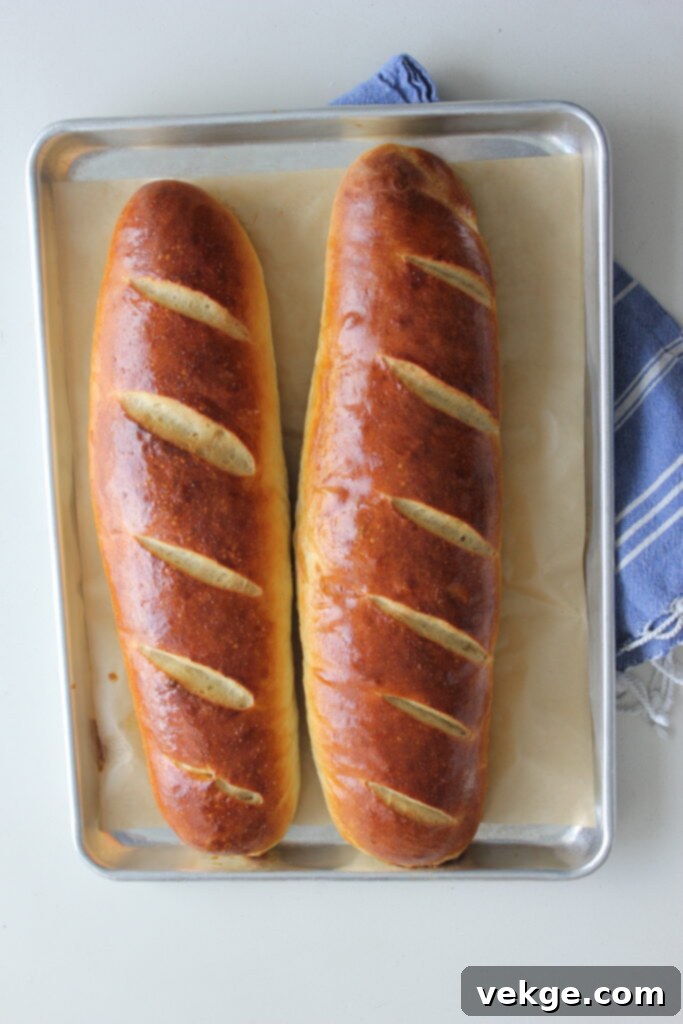 Artisan Rosemary Sourdough French Bread 6 Baked French bread cooling on a rack