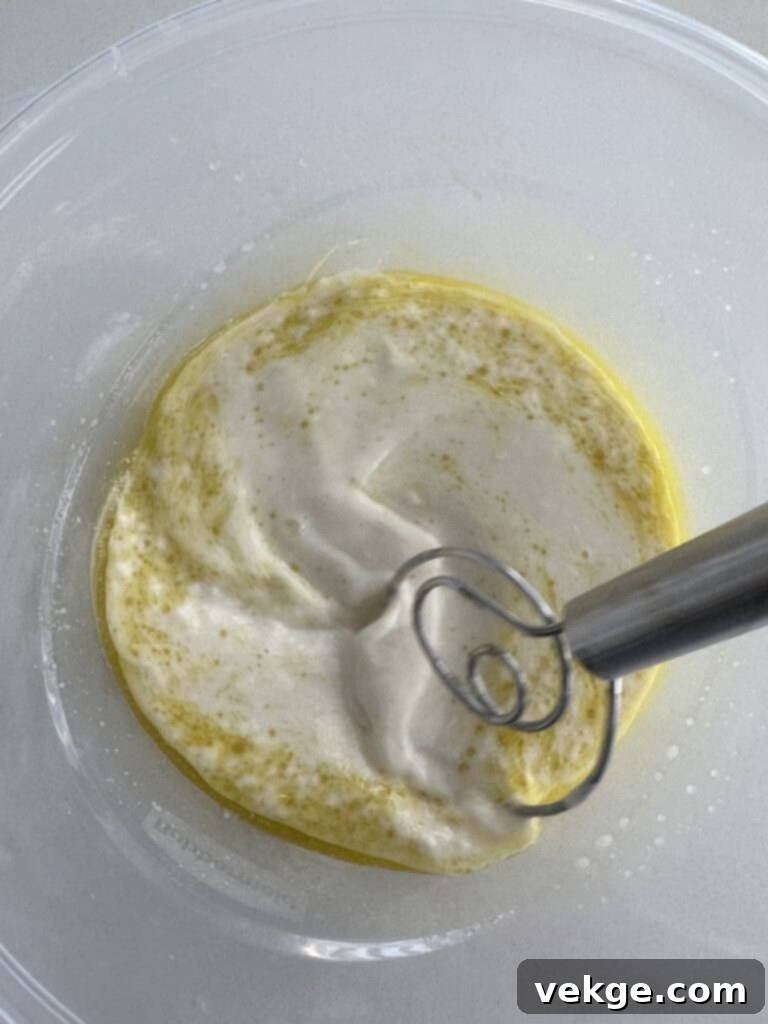 Artisan Rosemary Sourdough French Bread 8 Ingredients being combined in a mixer