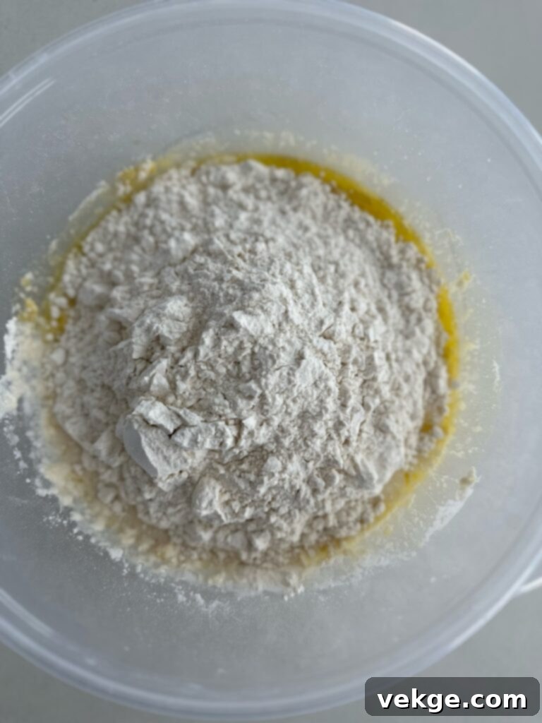 Artisan Rosemary Sourdough French Bread 9 Mixing dough in a stand mixer