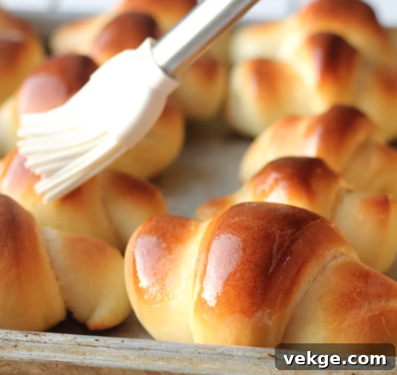 Irresistible Dinner Rolls 7 Close-up of a stack of freshly baked, fluffy dinner rolls.