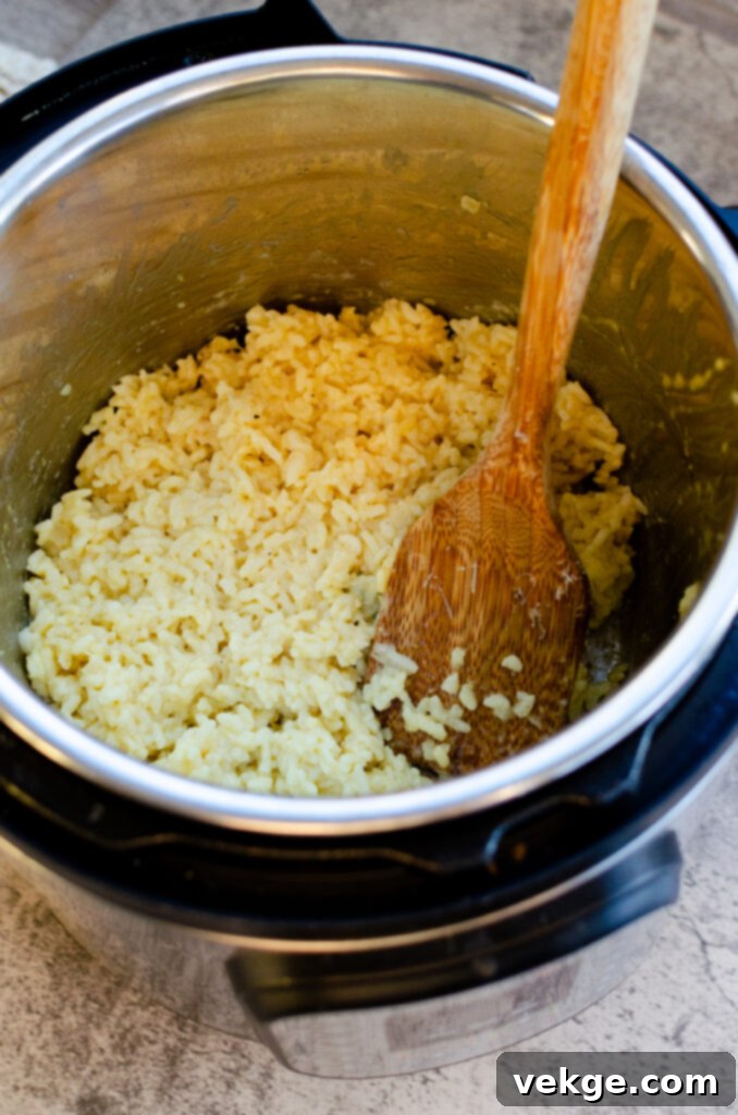 Effortless Instant Pot Risotto 5 Close-up of grated Parmesan cheese, ready to be added to risotto