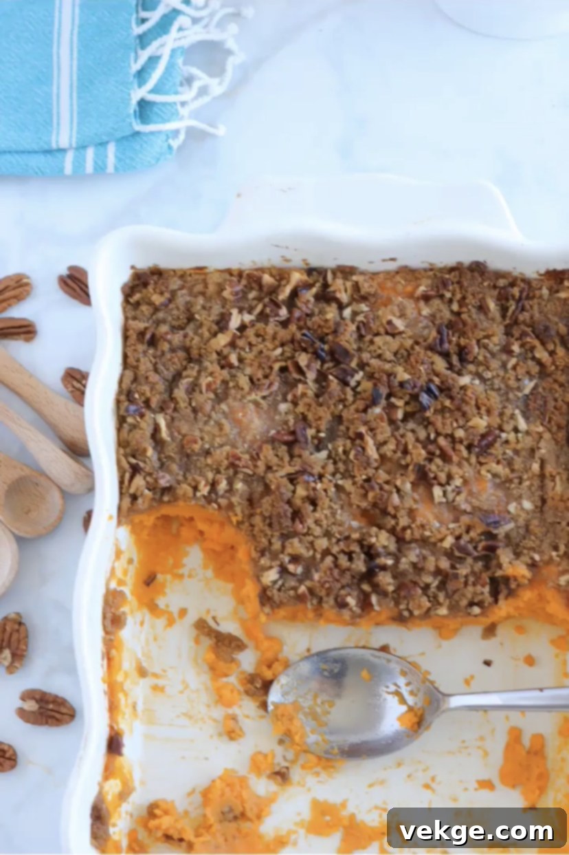 Close-up of the pecan streusel topping on a sweet potato casserole