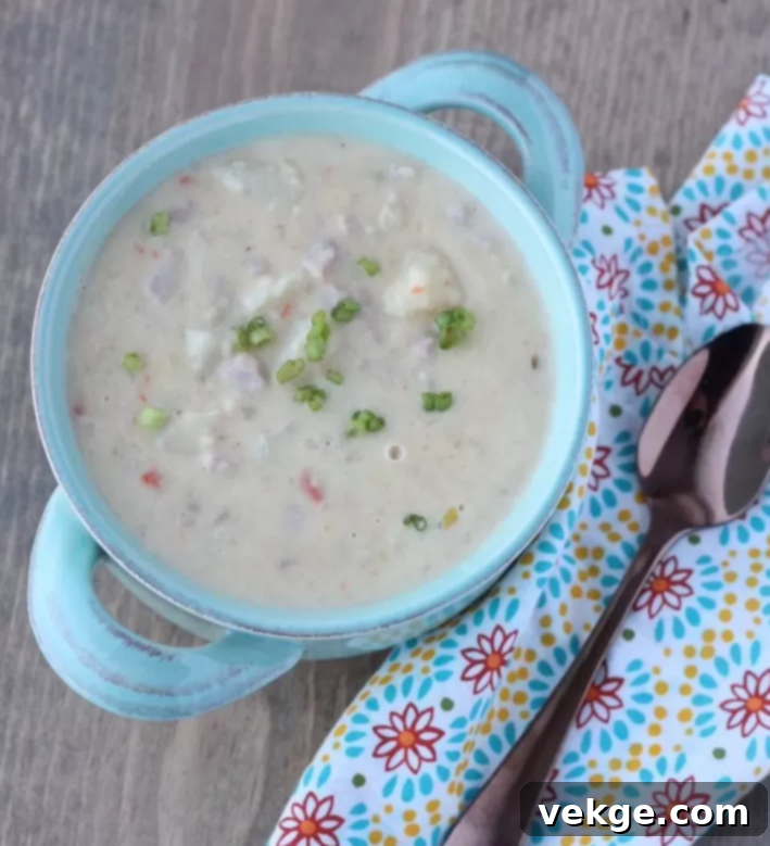 A beautifully presented bowl of creamy Ham and Potato Soup, ready to be enjoyed.