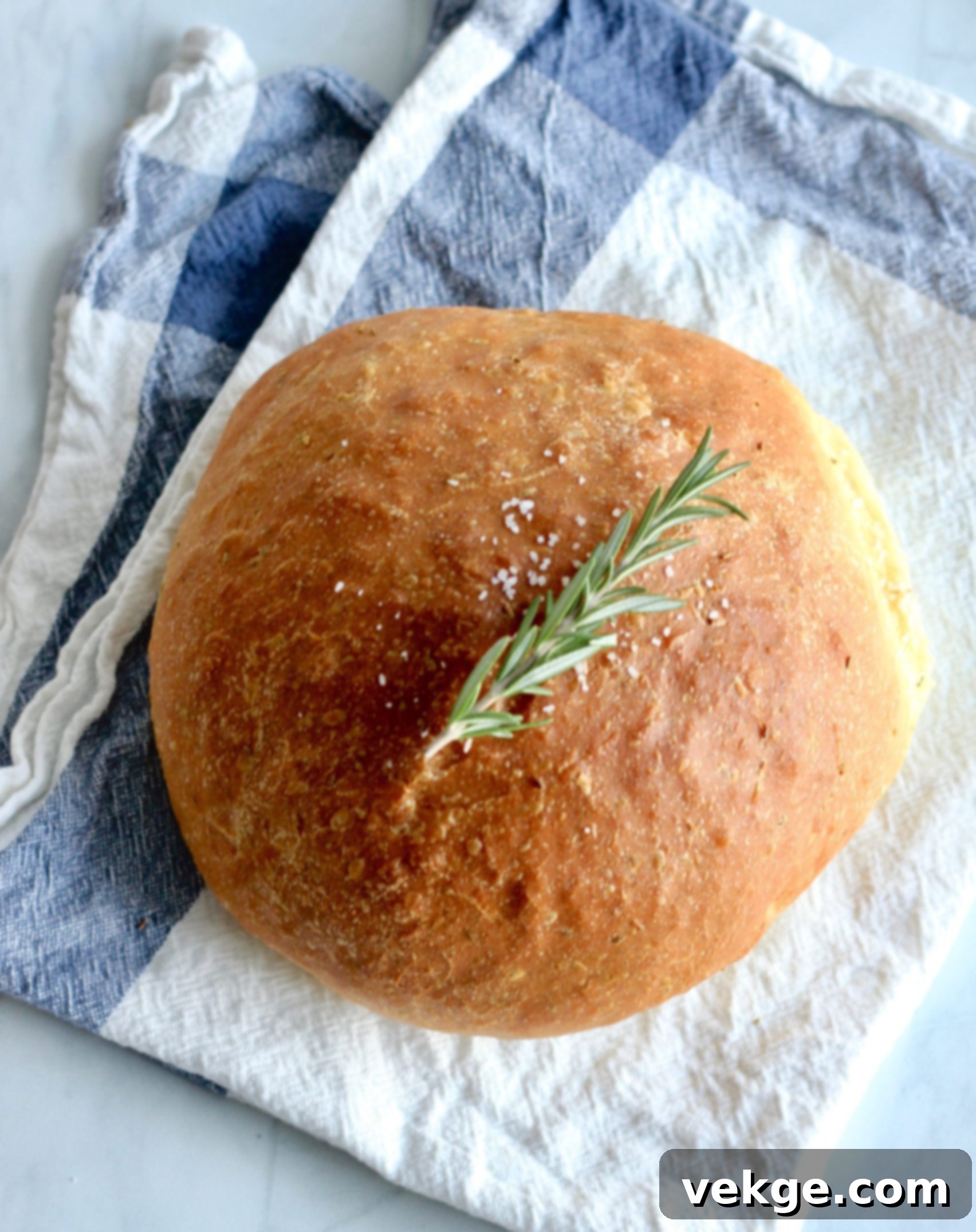 Fragrant Rosemary Bread 3 Close-up of golden, dimpled Rosemary Bread crust with visible rosemary flecks