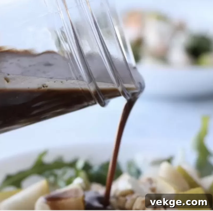 Gourmet Balsamic Vinaigrette 4 A small bowl of fresh balsamic dressing next to salad ingredients, highlighting the recipe.