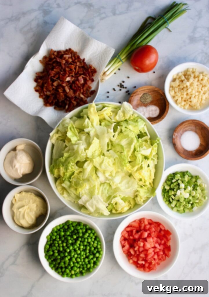 Classic Layered Salad with fresh ingredients in a glass bowl