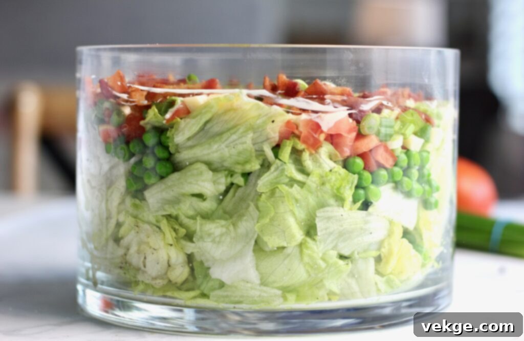 Finished layered salad in a glass bowl