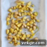 Sheet Pan Sausage and Veggies 4 Freshly diced red potatoes ready for roasting.