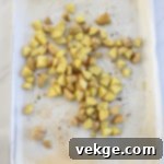 Sheet Pan Sausage and Veggies 5 A colorful mix of cauliflower florets and zucchini slices.