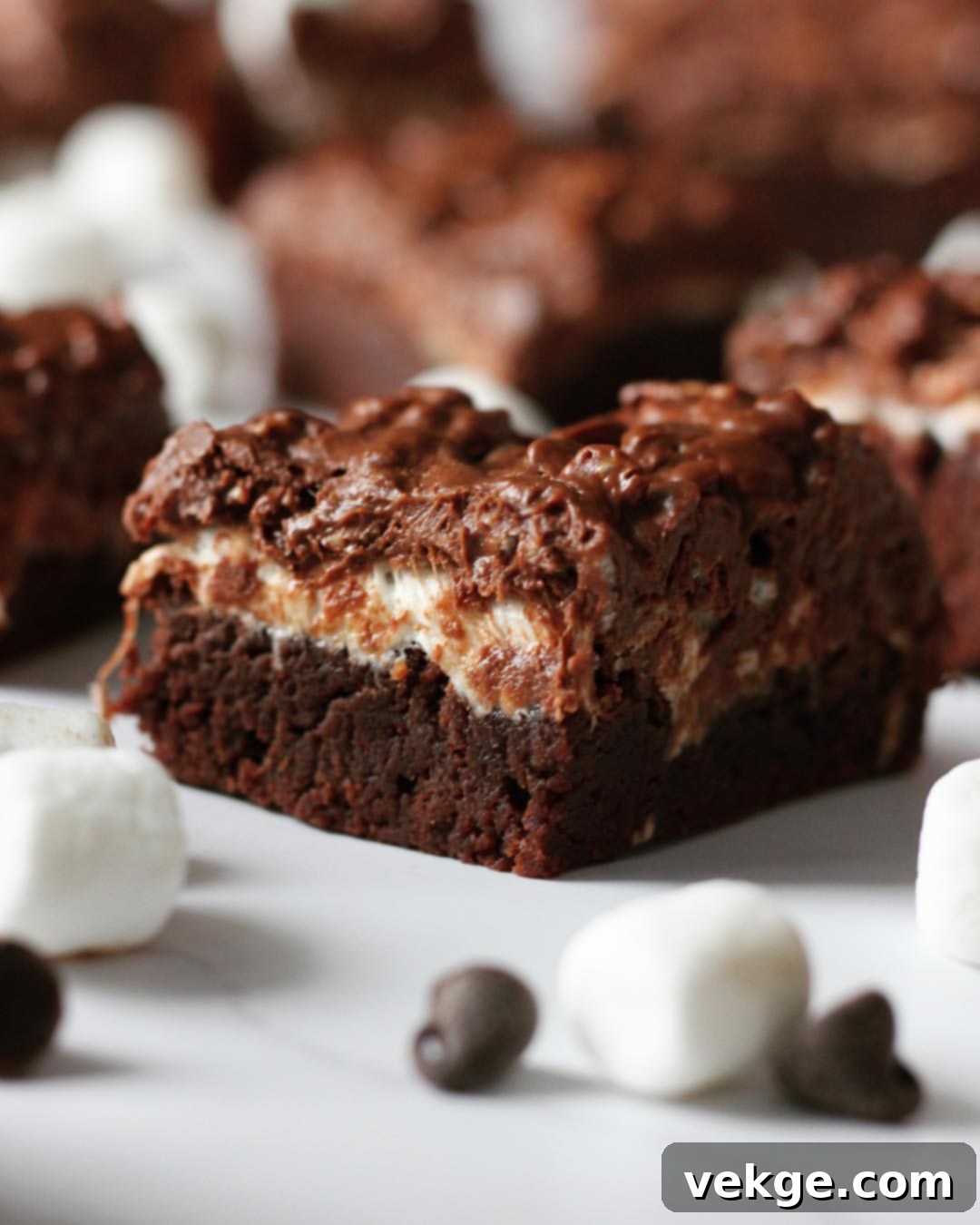 Peanut Butter Marshmallow Crunch Brownies 2 A close-up of the gooey marshmallow and crunchy Rice Krispies topping on a chocolate brownie, cut into squares
