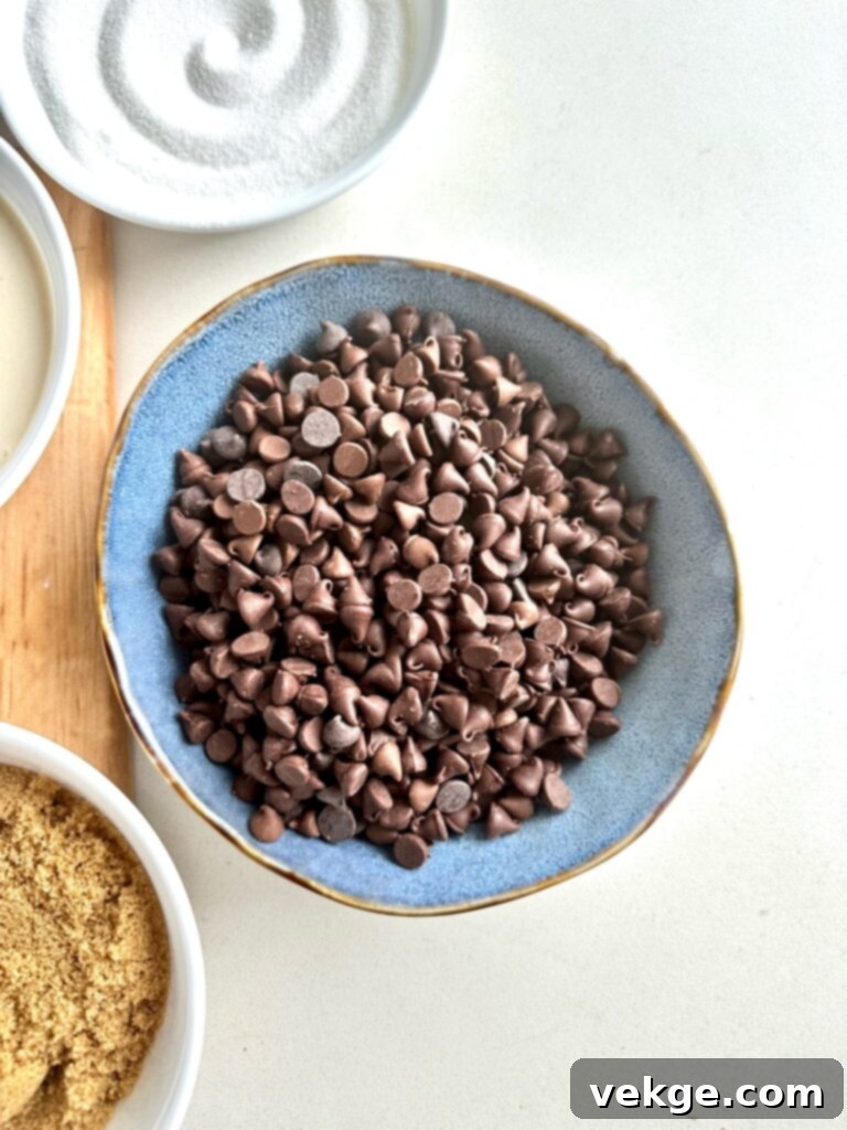 Artisan Brown Butter Chocolate Chip Bars 8 Close-up of chocolate chips being folded into cookie dough